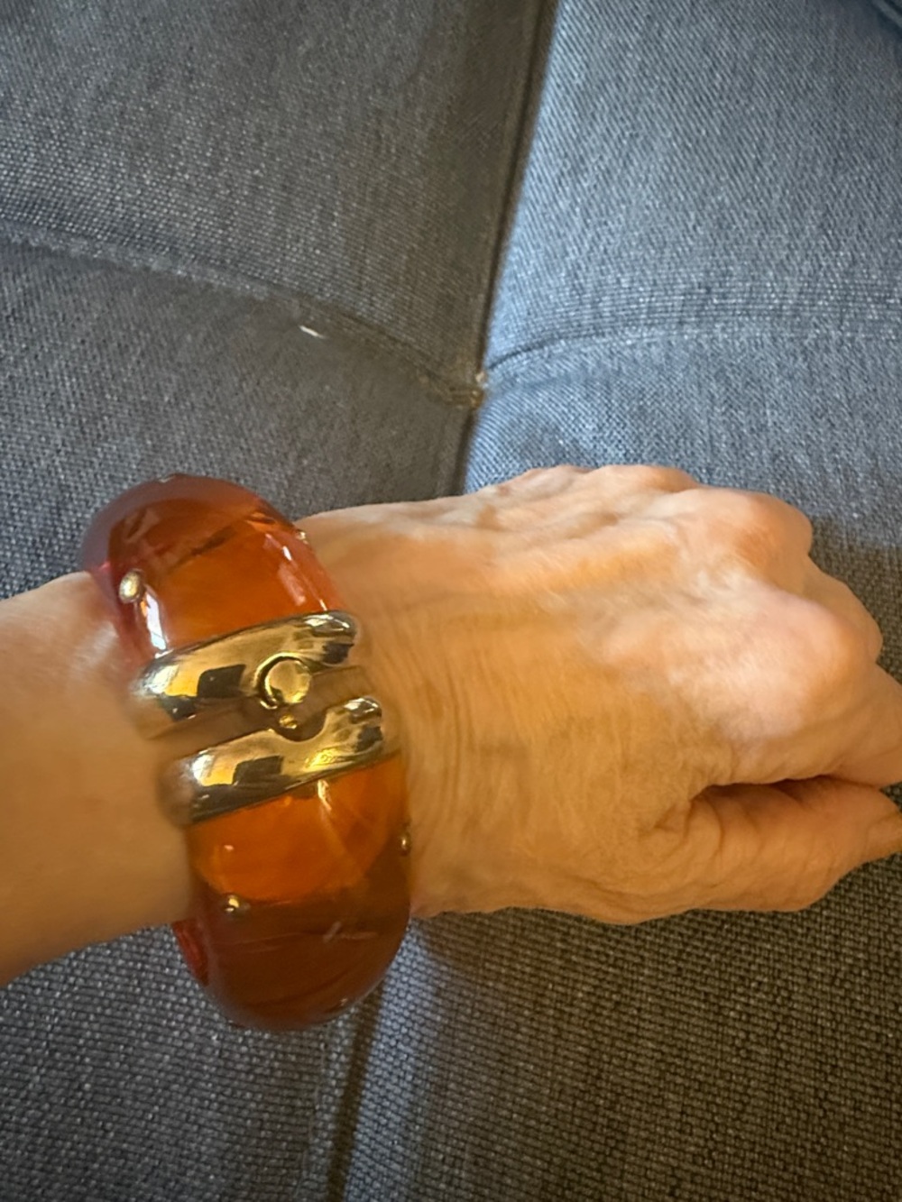 Hinged Studded Resin Bangle Bracelet Featuring a Translucent Amber Color. - Picture 1 of 5